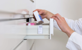 person looking at medicine cabinet